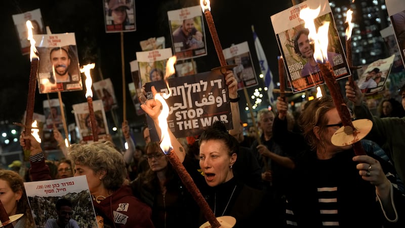 Relatives and friends of people killed and abducted by Hamas and taken into Gaza, react to the...